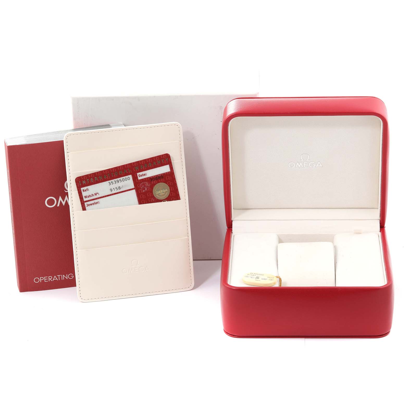 This image shows the Omega Speedmaster 3539.50.00 Men's Stainless Steel Black Dial 3539.50.00 Men's Stainless Steel Black Dial's red watch box, warranty card, and operating instructions from a straight-on angle.