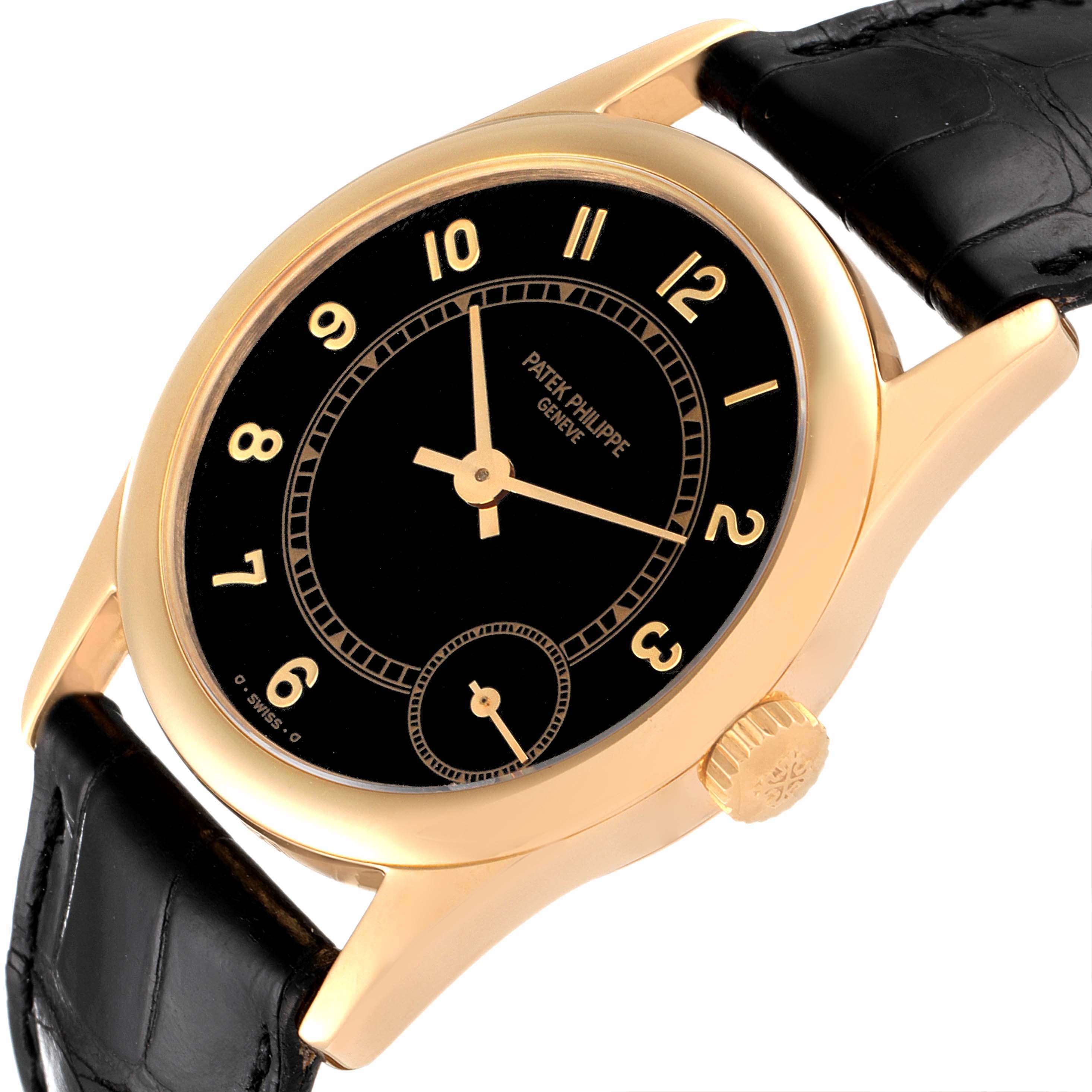 This image shows a Patek Philippe Calatrava 5000J Men's Yellow Gold Black Dial 5000J Men's Yellow Gold Black Dial watch, angled slightly from the side, highlighting the dial, bezel, crown, and black leather strap.