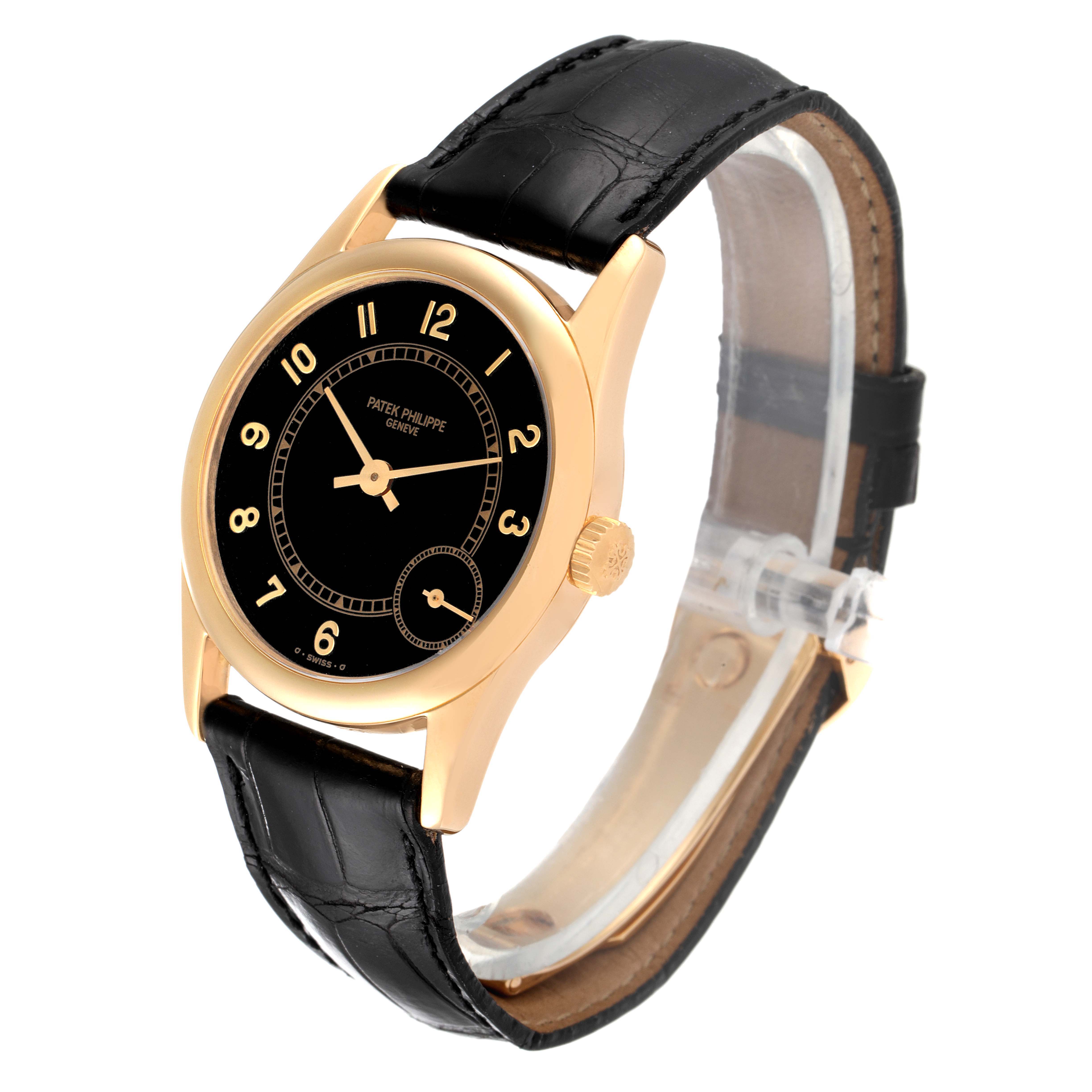 The image shows a Patek Philippe Calatrava 5000J Men's Yellow Gold Black Dial 5000J Men's Yellow Gold Black Dial model watch at a slight angle, displaying the face, strap, and crown.