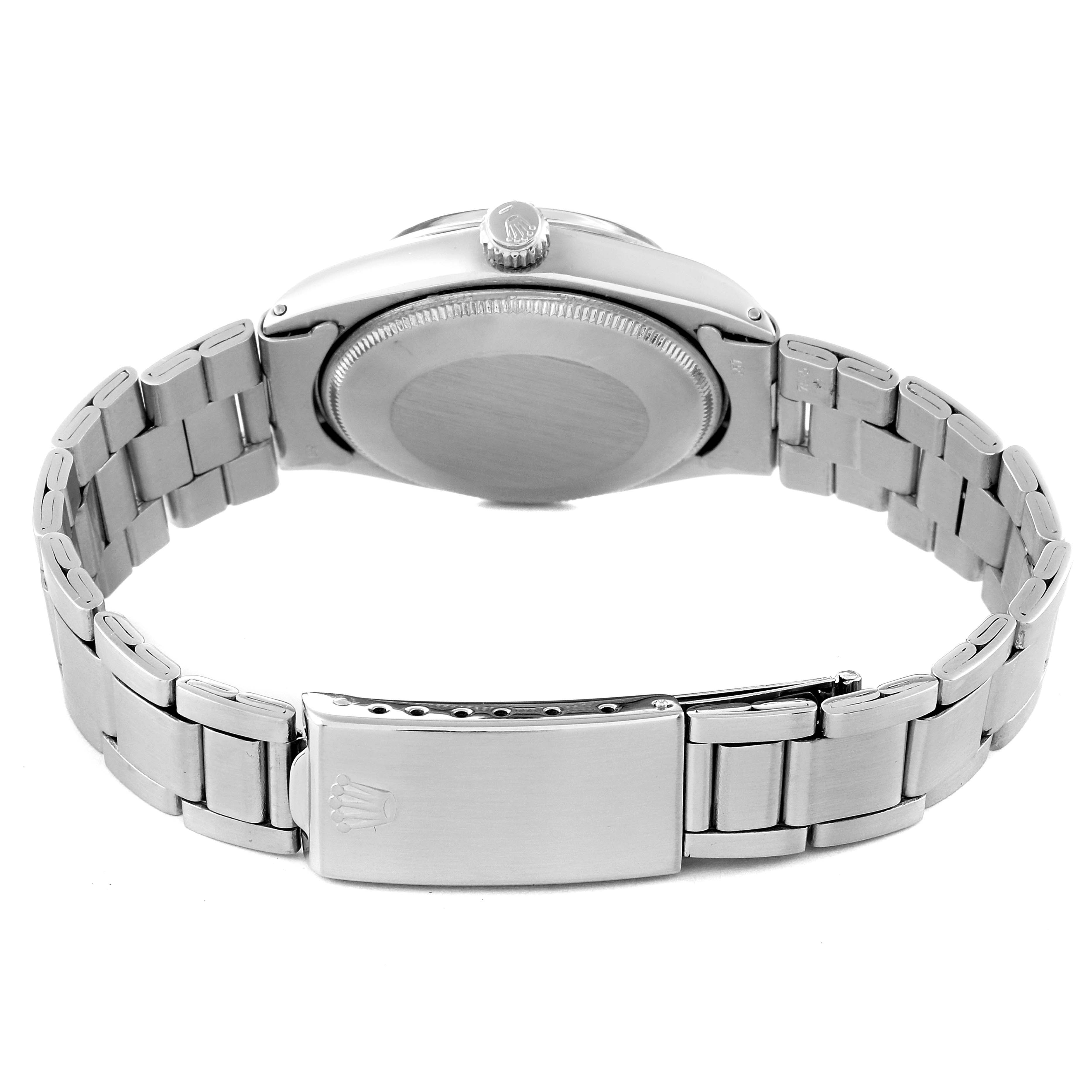 This image shows the backside of a Vintage Collection Rolex watch, highlighting the case back, crown, and clasp.