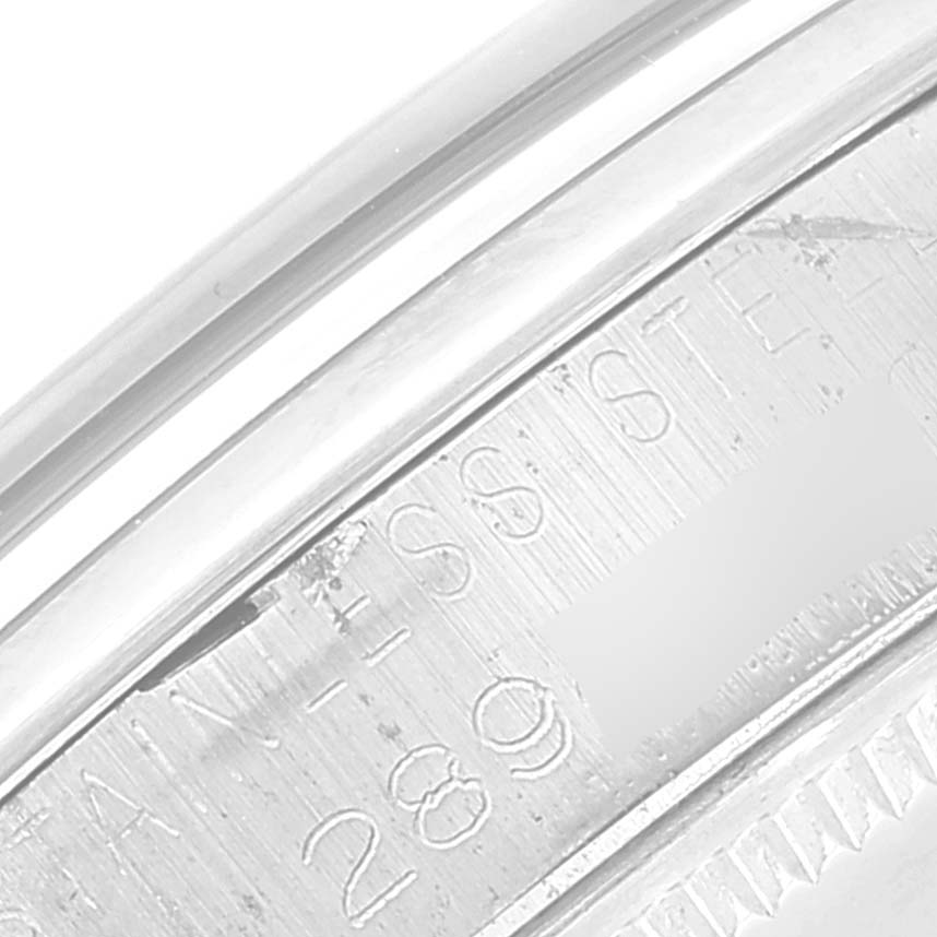 This is a close-up of the side of the bezel or case of the Rolex Vintage Collection 5500 Men
s Stainless Steel Silver Dial 5500 Men
s Stainless Steel Silver Dial model, showing part of its serial number and "STAINLESS STEEL" engraving.