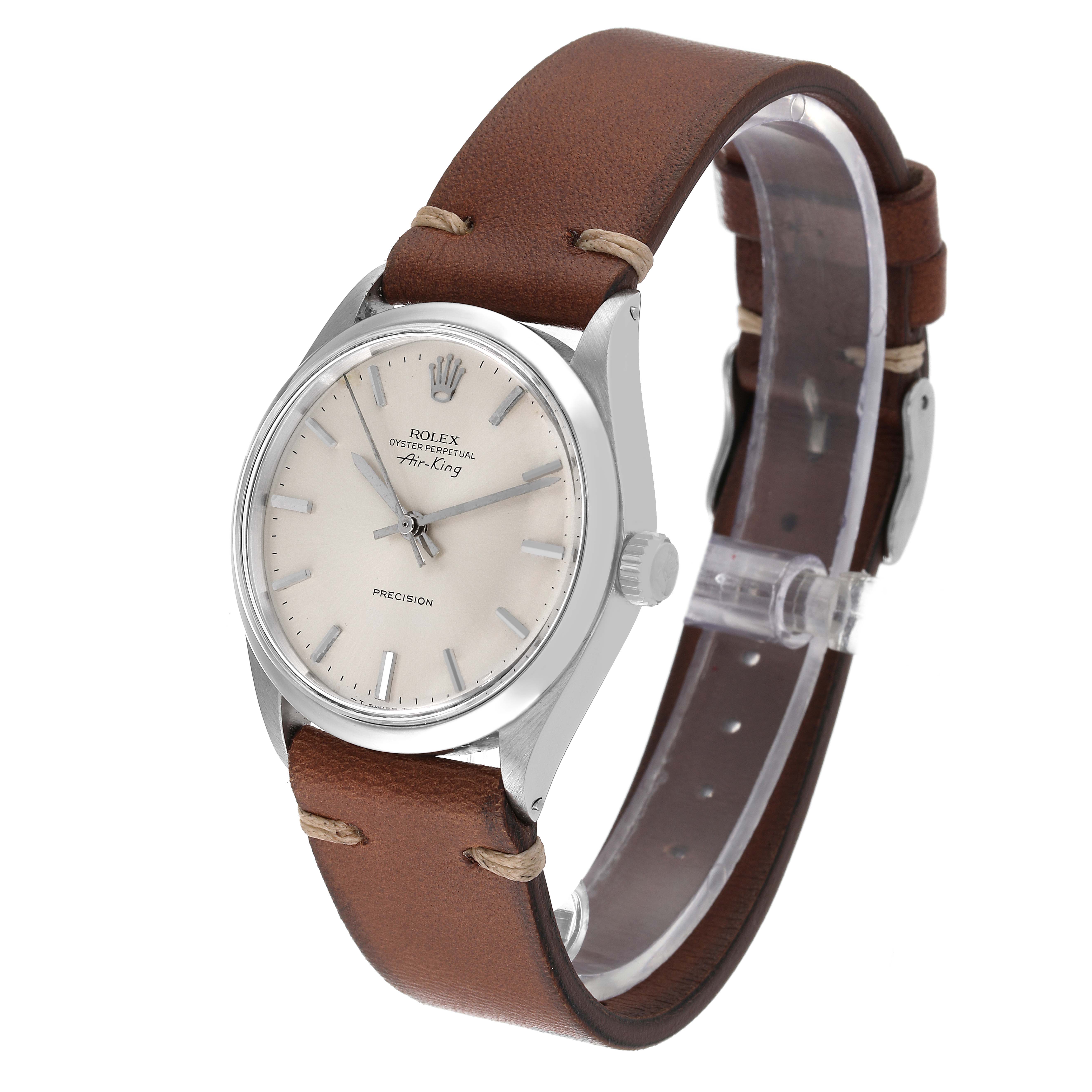 The image shows an angled view of the Rolex Vintage Collection 5500 Men
s Stainless Steel Silver Dial 5500 Men
s Stainless Steel Silver Dial model, featuring the watch face, crown, and brown leather strap.