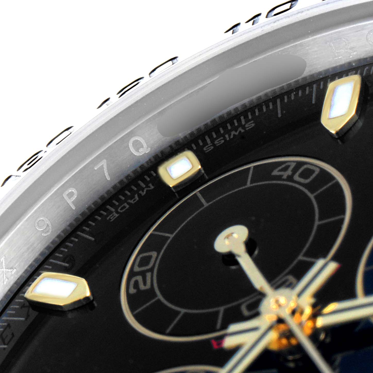 This close-up angle shows the bezel and part of the dial of a Rolex Daytona 116503 Men's Steel and Gold (two tone) Black Dial 116503 Men's Steel and Gold (two tone) Black Dial watch.