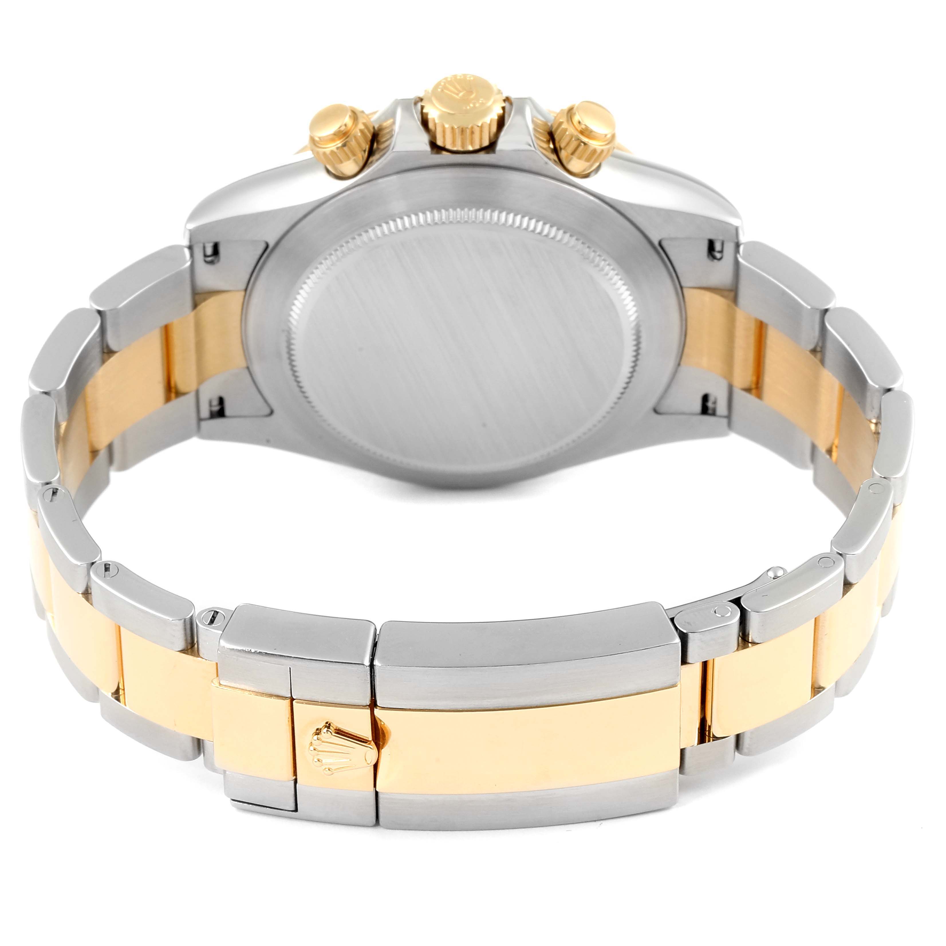 The image shows the back and clasp of a Rolex Daytona 116503 Men's Steel and Gold (two tone) White Dial 116503 Men's Steel and Gold (two tone) White Dial watch, highlighting its two-tone bracelet and crown.