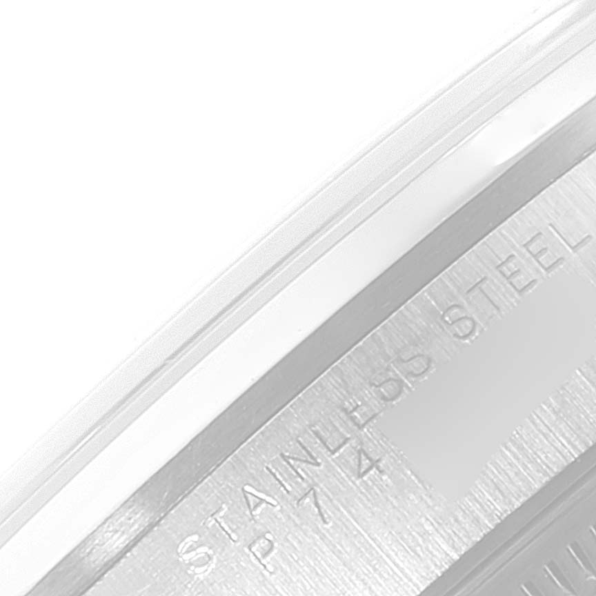 This image shows a close-up of the engraved serial number section on a Rolex Date 15200 Men's Stainless Steel Black Dial 15200 Men's Stainless Steel Black Dial model watch, highlighting "STAINLESS STEEL."