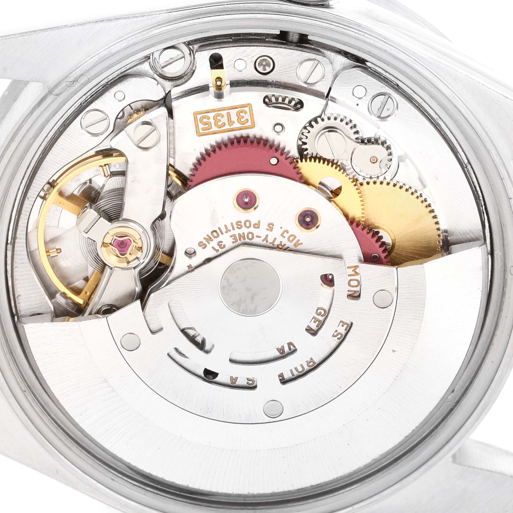 The image shows the internal mechanism of a Rolex Date 15210 Men's Stainless Steel Black Dial 15210 Men's Stainless Steel Black Dial model watch from a back angle, highlighting gears and components.