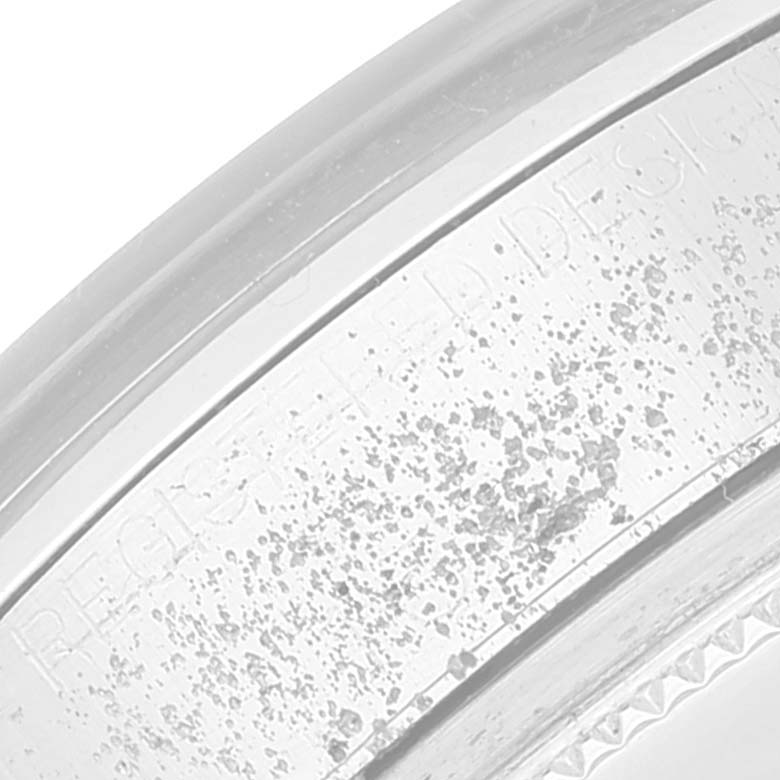 This close-up image shows the side view of the bezel and engraving on a Rolex Vintage Collection 1500 Men
s Stainless Steel Grey Dial 1500 Men
s Stainless Steel Grey Dial watch.