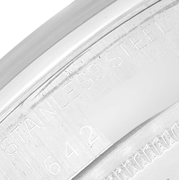 This image shows a close-up of the stainless steel casing with engravings on the Vintage Collection model by Rolex.