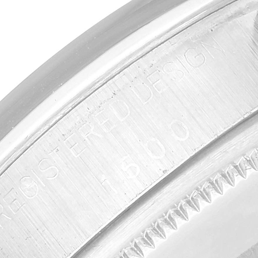 The close-up image shows the engraved details on the metal casing of a Rolex Vintage Collection 1500 Men's Stainless Steel Grey Dial 1500 Men's Stainless Steel Grey Dial model.