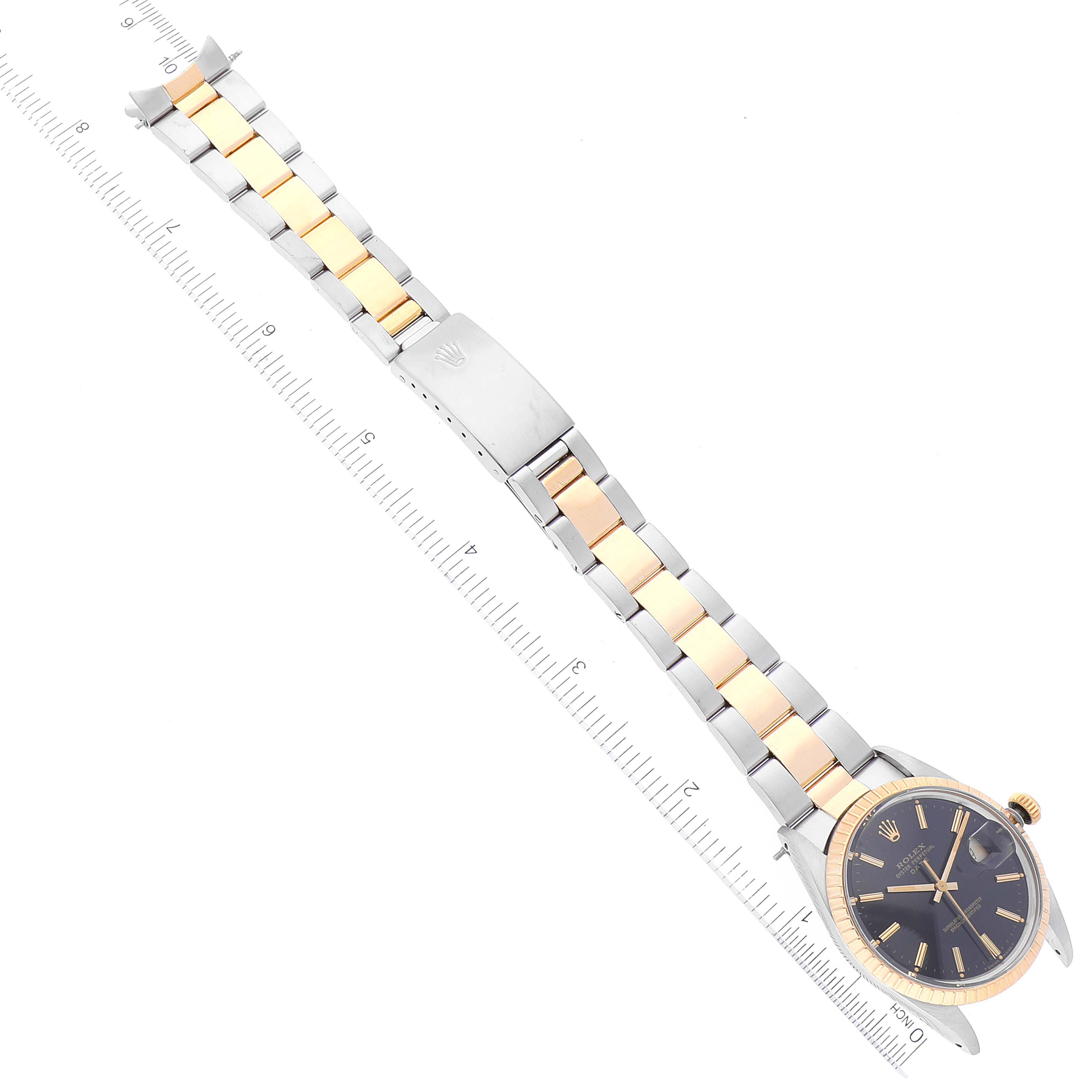 The Rolex Date 15053 Men's Steel and Gold (two tone) Black Dial 15053 Men's Steel and Gold (two tone) Black Dial model watch is shown from an overhead angle, displaying the face, band, and clasp.