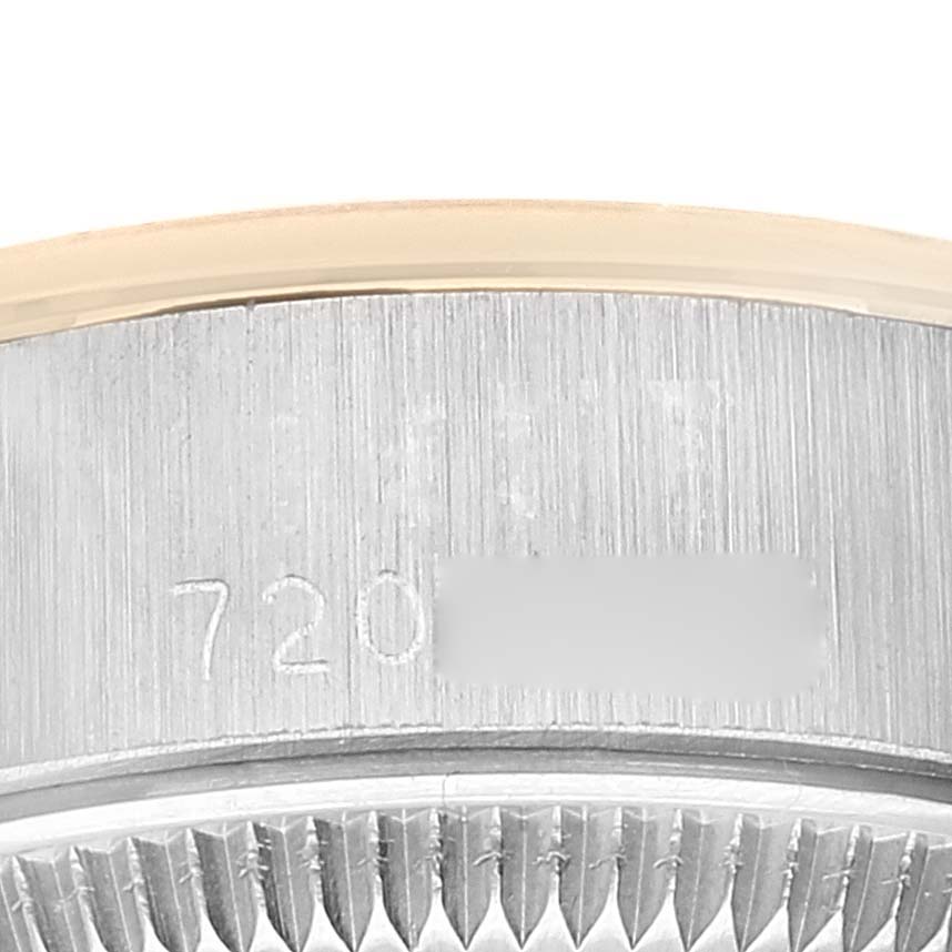 This is a close-up image of the serial number engraving on the case side of a Rolex Date 6916 Women's Steel and Gold (two tone) Champagne Dial 6916 Women's Steel and Gold (two tone) Champagne Dial model watch.