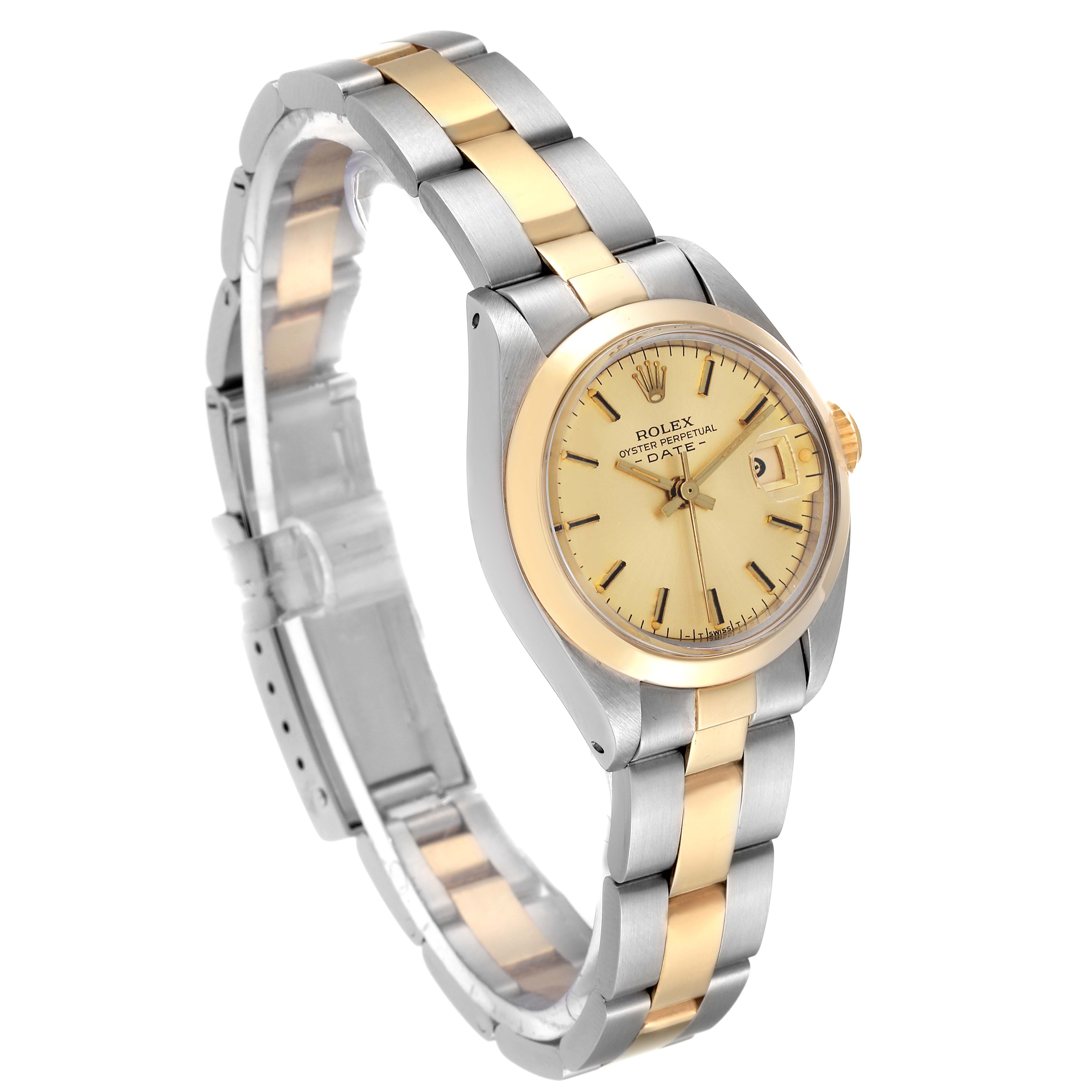 The image shows a Rolex Date 6916 Women's Steel and Gold (two tone) Champagne Dial 6916 Women's Steel and Gold (two tone) Champagne Dial model watch at an angled view, highlighting its two-tone bracelet, case, and dial.