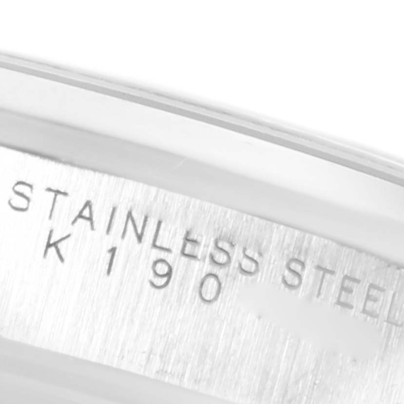 The image shows a close-up of the stainless steel case with model information engraved on a Rolex Date 15200 Men's Stainless Steel White Dial 15200 Men's Stainless Steel White Dial watch.
