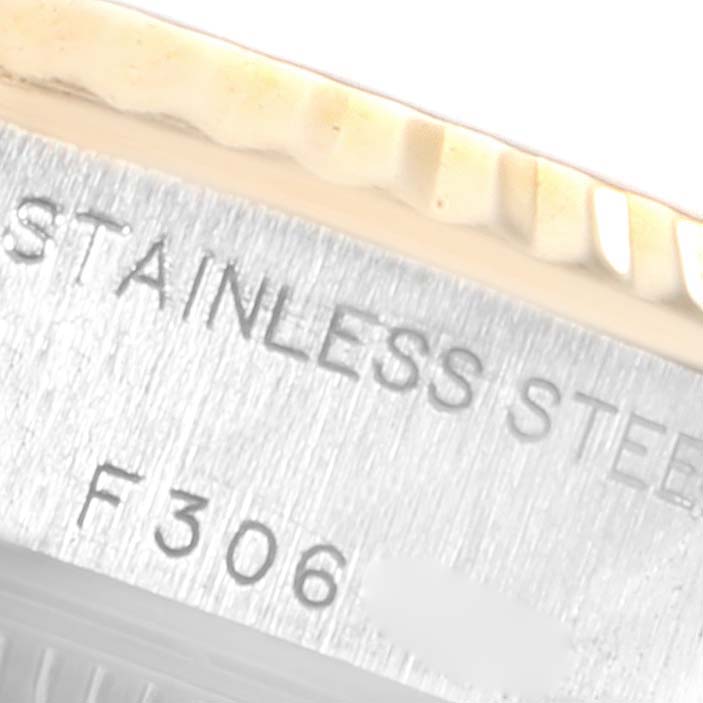 This image shows a close-up angle of the stainless steel case and the fluted bezel of a Rolex Datejust 79173 Women's Steel and Gold (two tone) White Dial 79173 Women's Steel and Gold (two tone) White Dial watch.