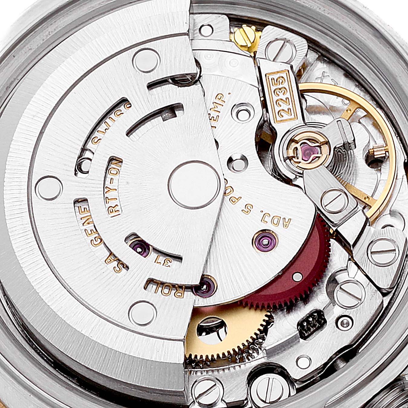 The image shows a close-up of the movement mechanism of a Rolex Datejust 79173 Women's Steel and Gold (two tone) White Dial 79173 Women's Steel and Gold (two tone) White Dial watch, highlighting its intricate inner components.