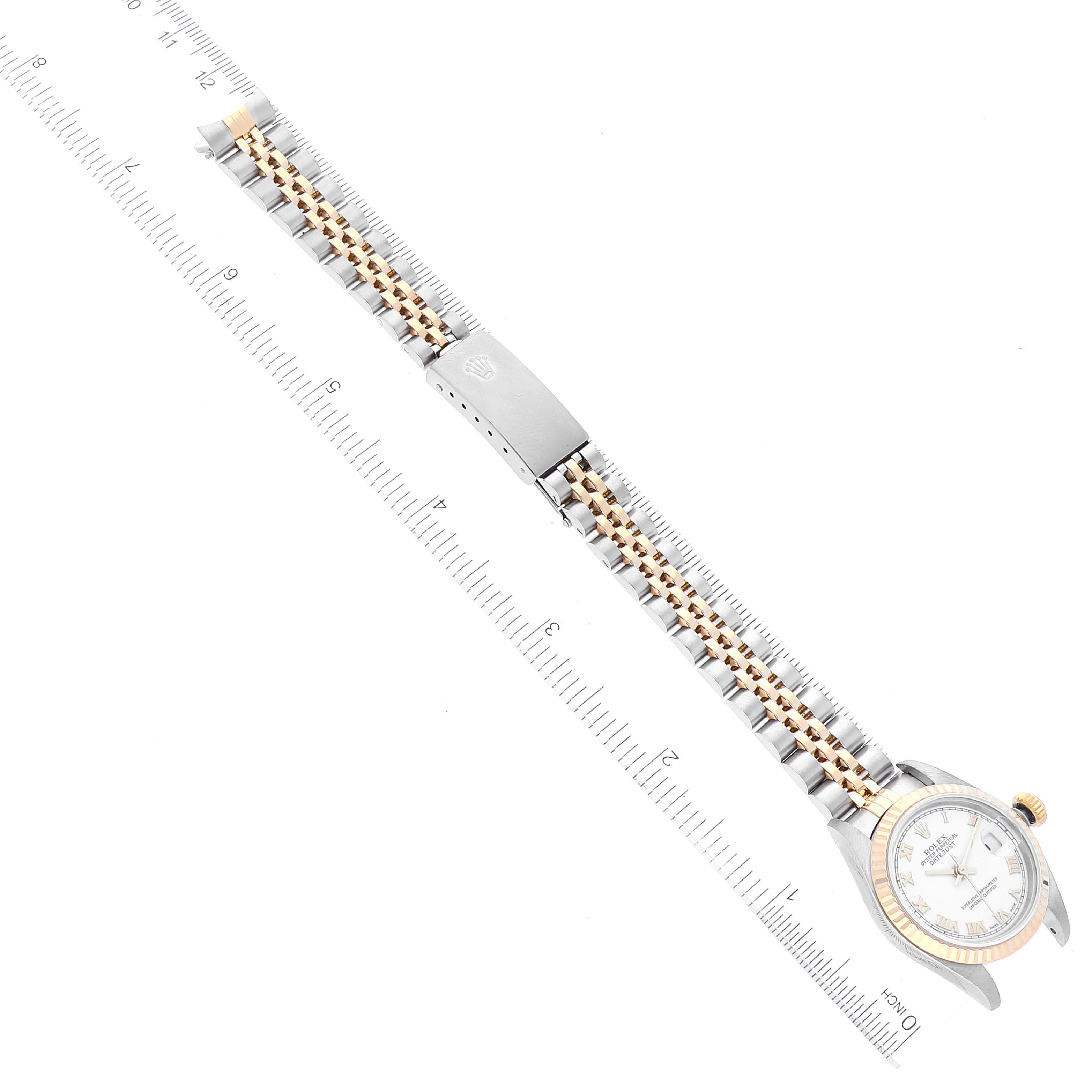 The image shows a Rolex Datejust 79173 Women's Steel and Gold (two tone) White Dial 79173 Women's Steel and Gold (two tone) White Dial watch laid flat with its entire face, bezel, and two-tone bracelet visible.