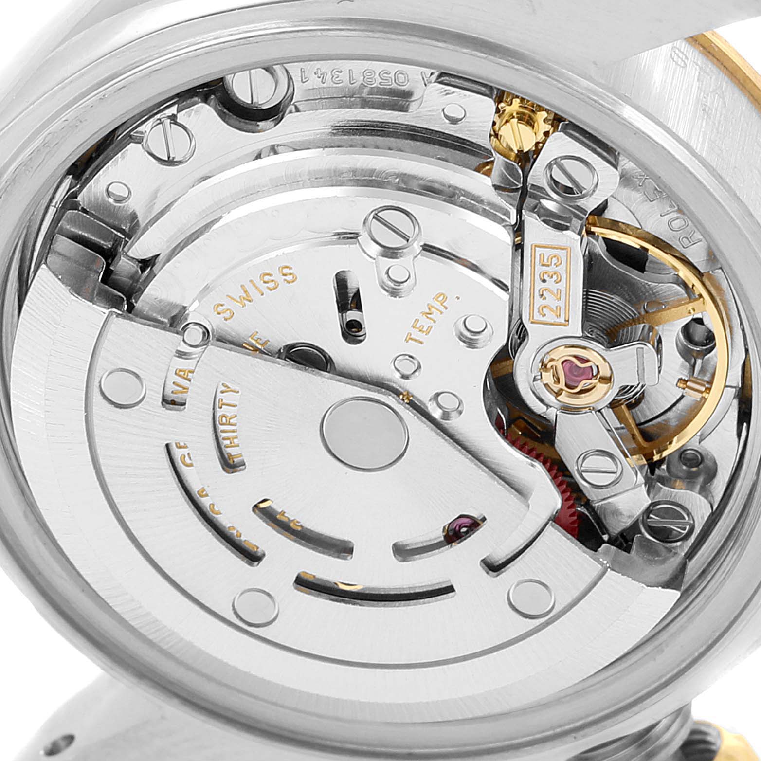 This image shows a close-up view of the Rolex Datejust 79173 Women's Steel and Gold (two tone) White Dial 79173 Women's Steel and Gold (two tone) White Dial model's movement and inner mechanism components.
