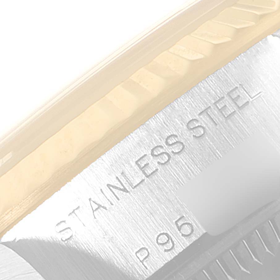 This image shows a close-up of the case back edge of a Rolex Datejust 79173 Women's Steel and Gold (two tone) White Dial 79173 Women's Steel and Gold (two tone) White Dial, highlighting the stainless steel marking.
