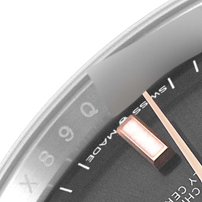 The image shows a zoomed-in view of a Rolex Datejust 126231 Men's Steel and Gold (two tone) Grey Dial 126231 Men's Steel and Gold (two tone) Grey Dial watch dial, displaying part of the date indicator and an hour marker.