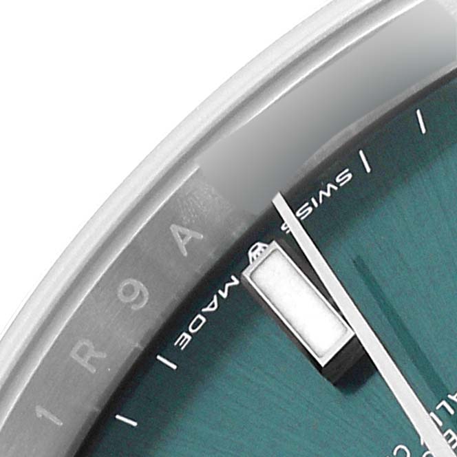 The close-up image shows a section of the dial and part of the bezel of a Rolex Datejust 41 126300 Men
s Stainless Steel Green Dial 126300 Men
s Stainless Steel Green Dial watch.