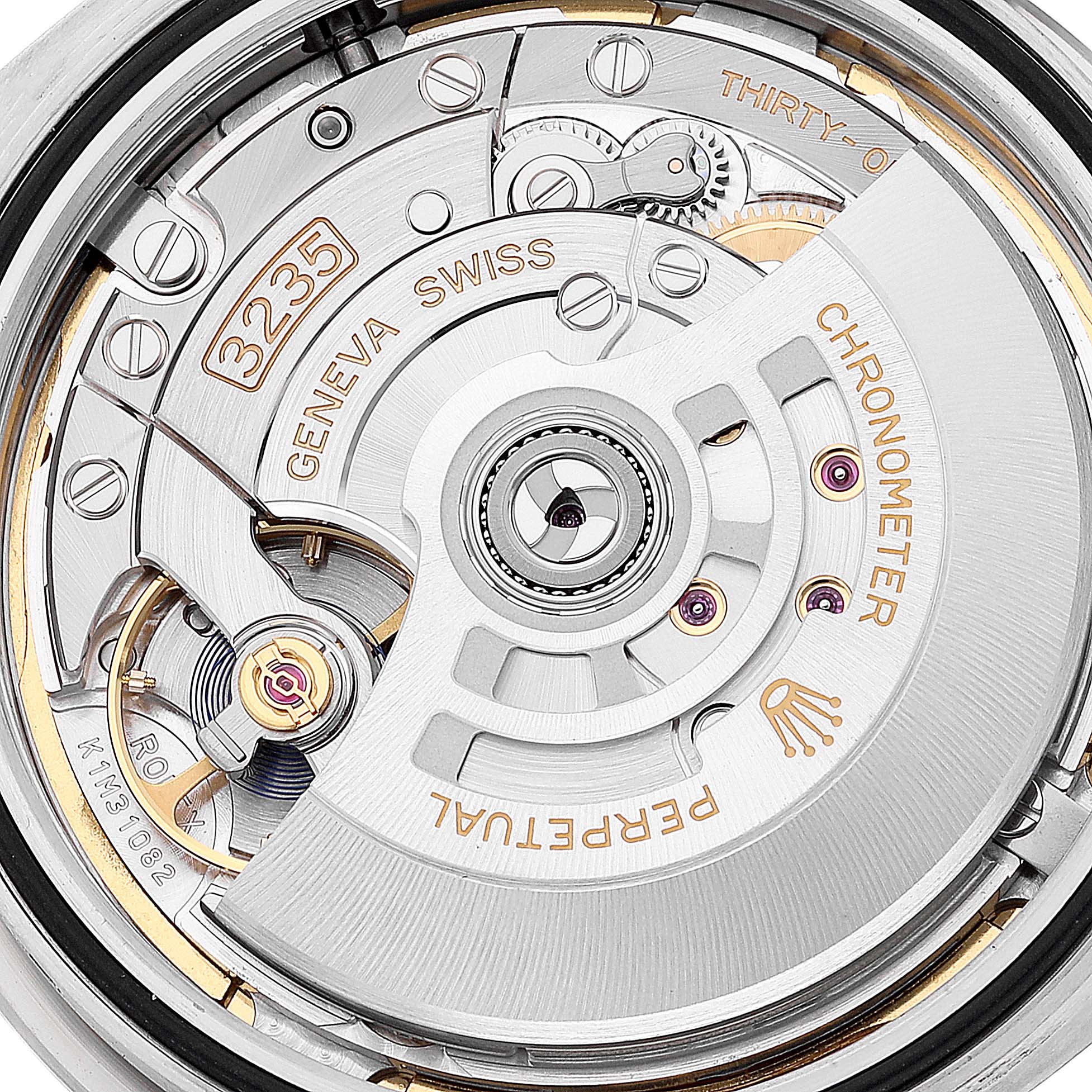 The image shows the intricate movement mechanism of the Rolex Datejust 41 126334 Men
s Stainless Steel Green Dial 126334 Men
s Stainless Steel Green Dial watch, viewed from the back.