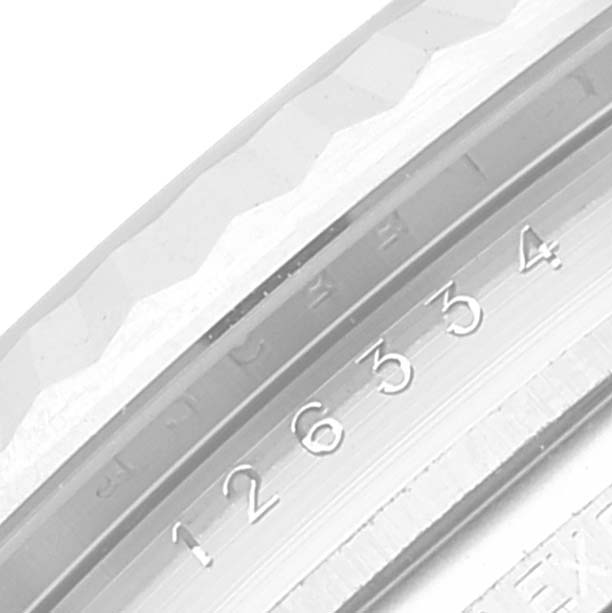 The image shows a close-up of the case with serial number inscriptions of a Rolex Datejust 41 126334 Men
s Stainless Steel Green Dial 126334 Men
s Stainless Steel Green Dial model.