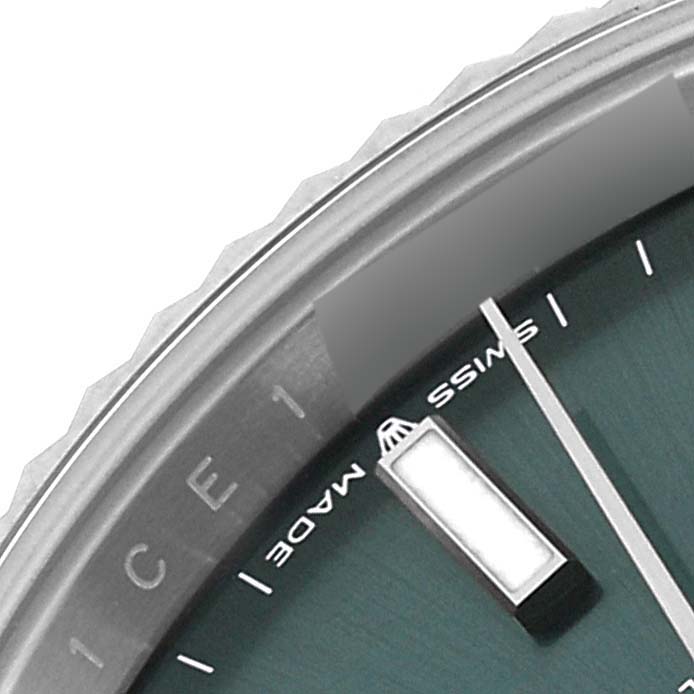 This image shows a close-up of the bezel, dial, and indices of the Rolex Datejust 41 126334 Men
s Stainless Steel Green Dial 126334 Men
s Stainless Steel Green Dial watch.