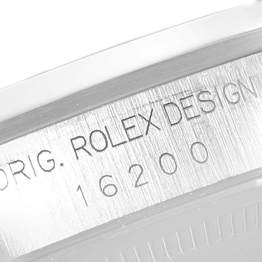 The image shows a close-up angle of the model number "16200" etched on the case of a Rolex Datejust 16200 Men
s Stainless Steel Black Dial 16200 Men
s Stainless Steel Black Dial watch.