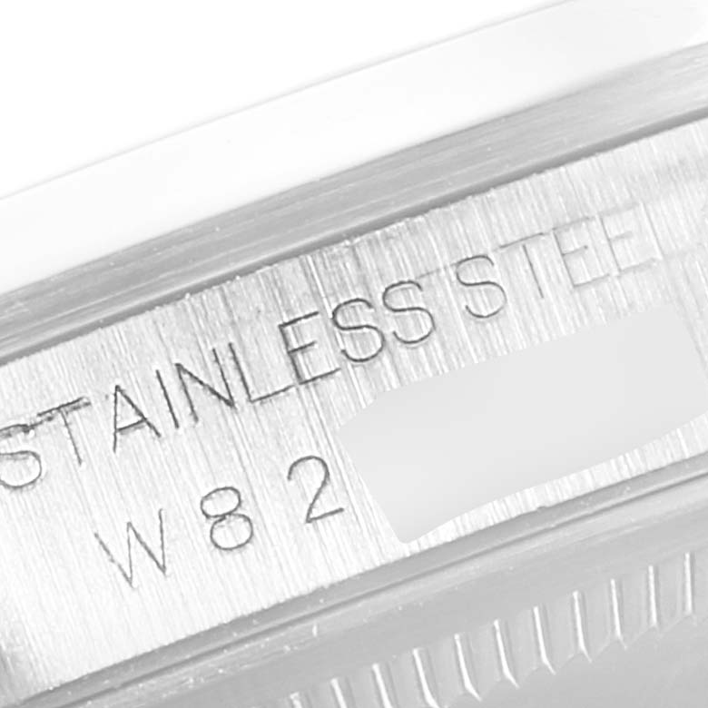 This close-up image shows the side of the stainless steel case of a Rolex Datejust 16200 Men
s Stainless Steel Black Dial 16200 Men
s Stainless Steel Black Dial watch, highlighting part of the engraving.