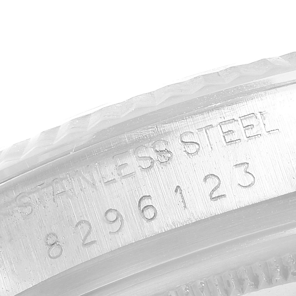 This image shows the stainless steel casing edge and serial number of a Rolex Datejust 16014 Men
s Stainless Steel Silver Dial 16014 Men
s Stainless Steel Silver Dial watch.