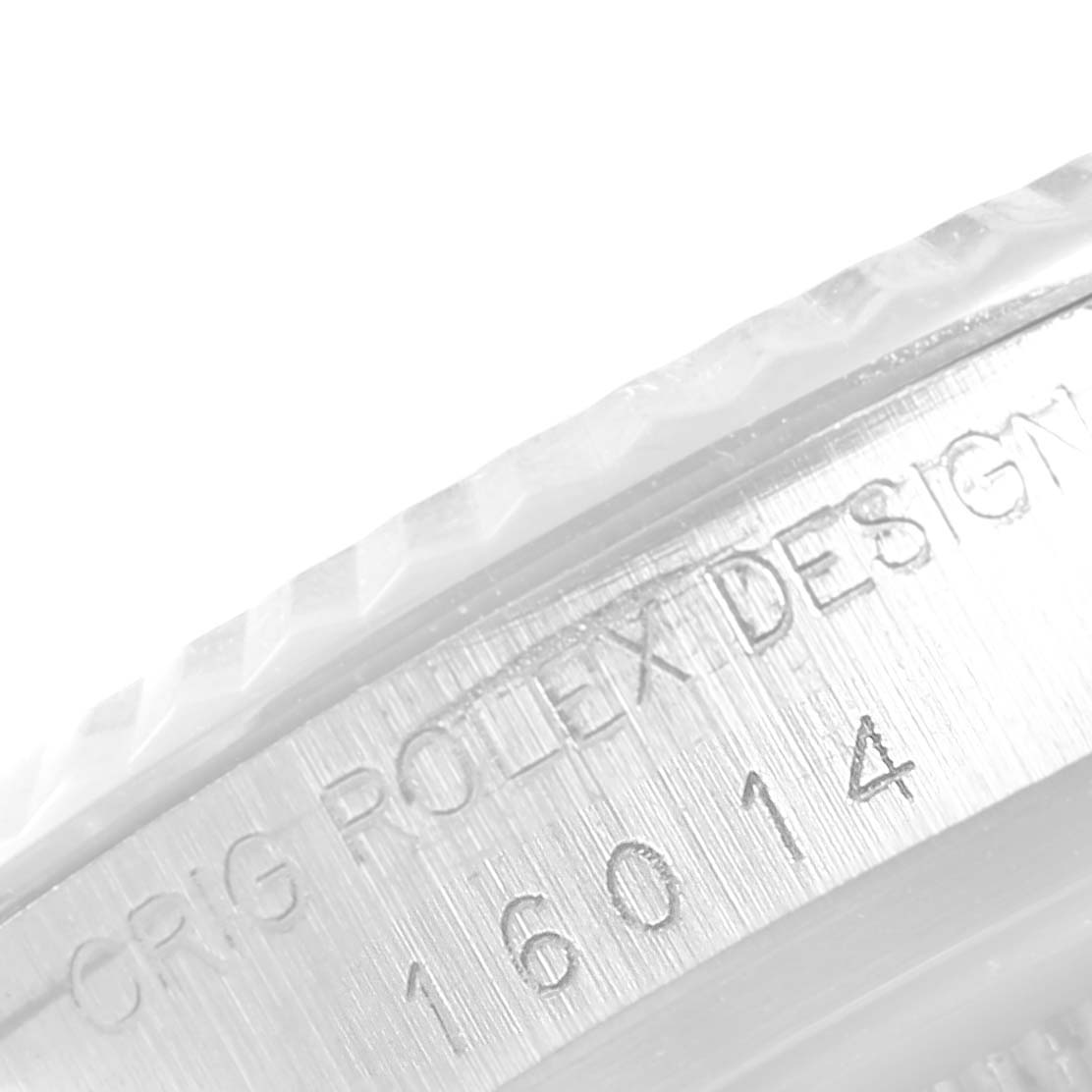 This close-up image shows the engraved model number and design inscription on the case of a Rolex Datejust 16014 Men
s Stainless Steel Silver Dial 16014 Men
s Stainless Steel Silver Dial.