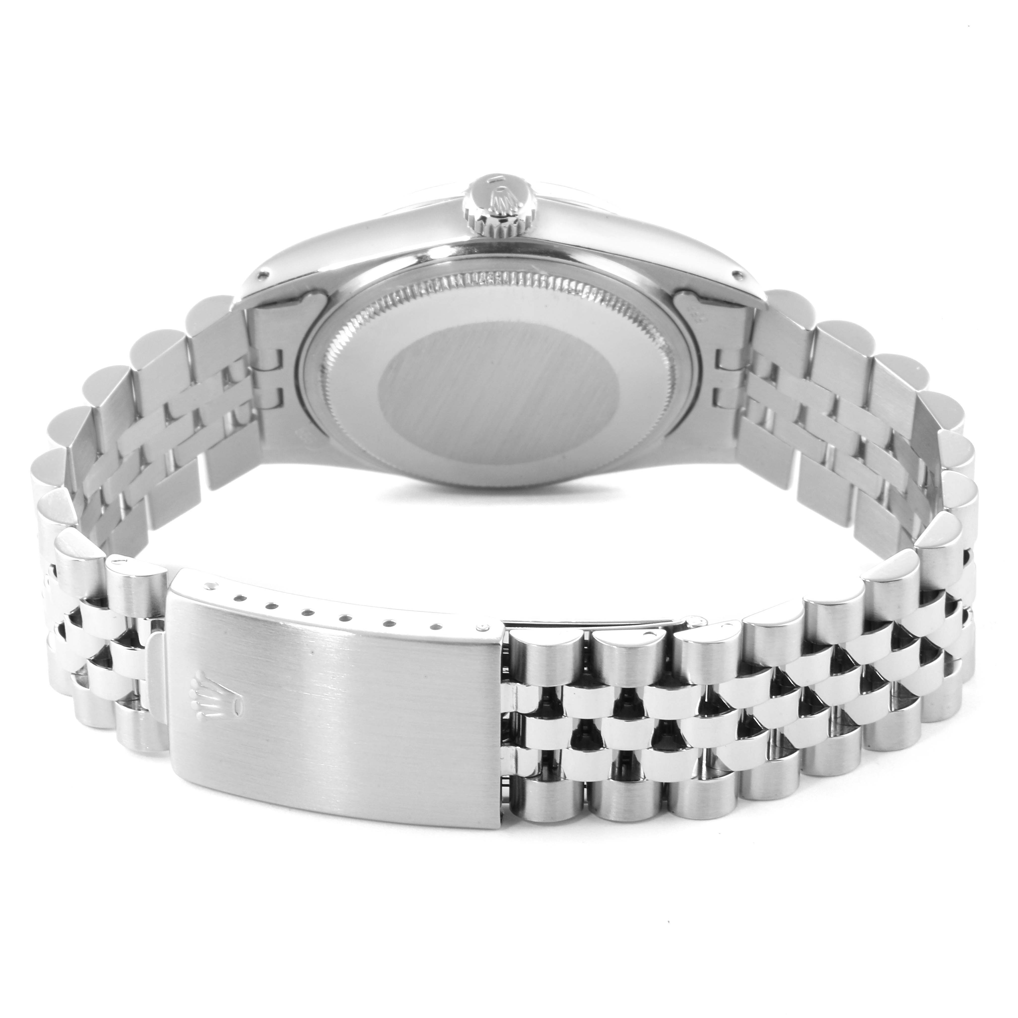 This image shows the back view of a Rolex Datejust 16014 Men
s Stainless Steel Silver Dial 16014 Men
s Stainless Steel Silver Dial watch, focusing on the case back and the clasp of the bracelet.