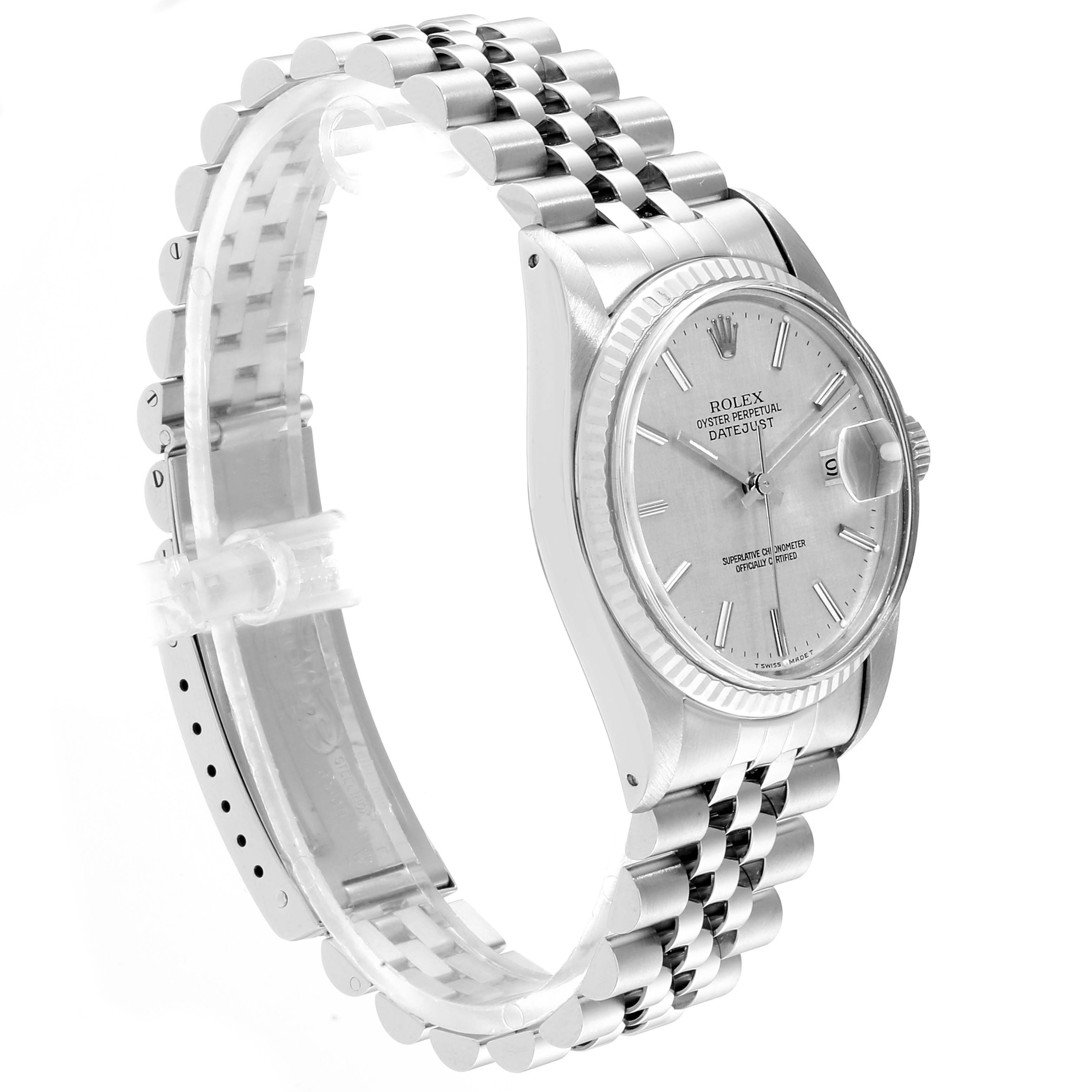 The image shows the Rolex Datejust 16014 Men
s Stainless Steel Silver Dial 16014 Men
s Stainless Steel Silver Dial watch from a three-quarter angle, highlighting its face, bezel, and bracelet.