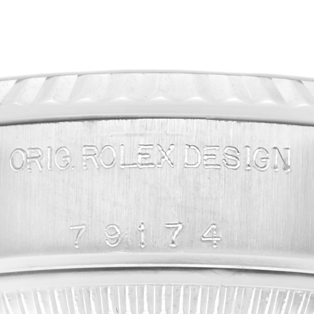 The image shows a close-up of the side of a Rolex Datejust 69174 Women's Stainless Steel Pink Dial 69174 Women's Stainless Steel Pink Dial watch bezel and case, detailing the model number 79174.