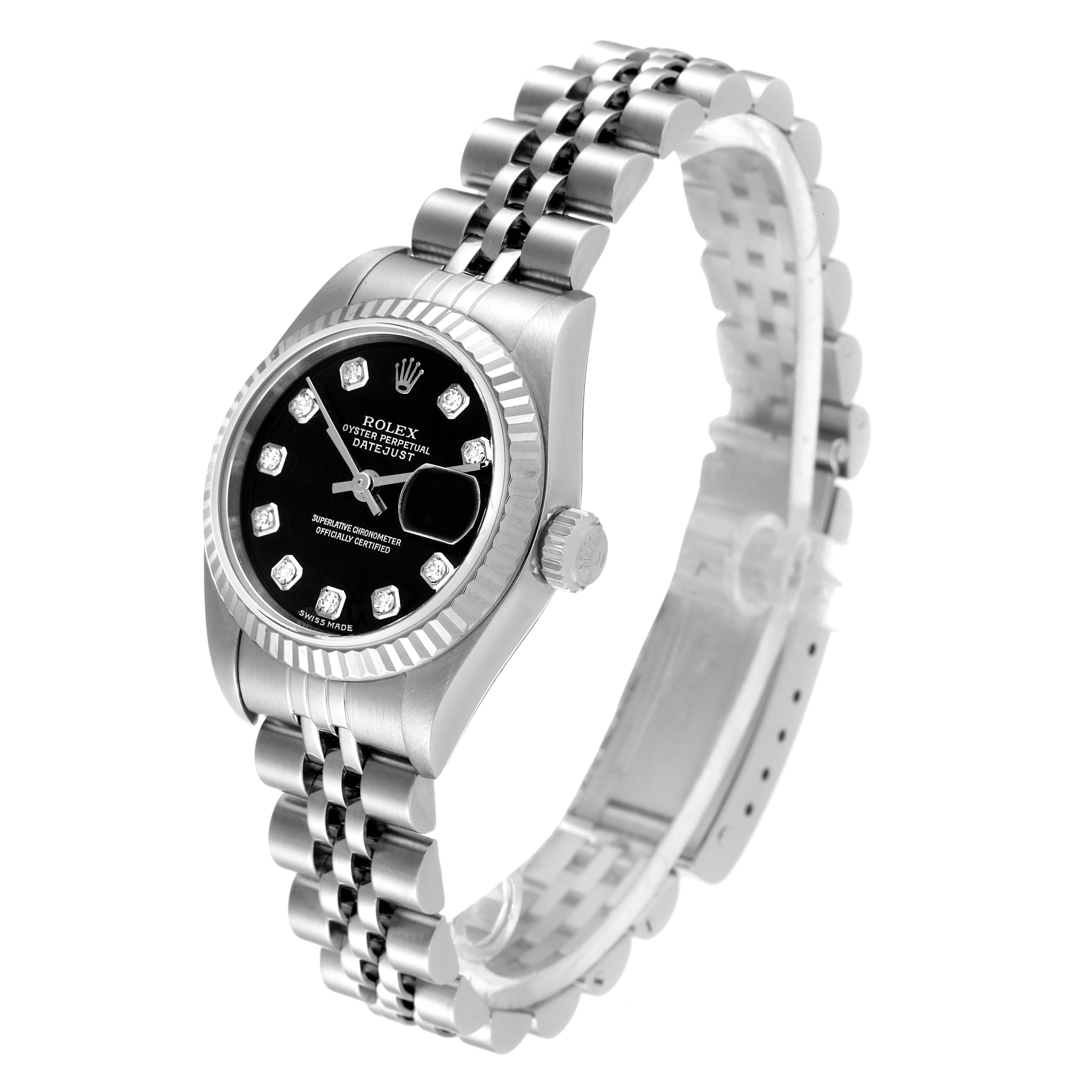 The Rolex Datejust 79174 Women's Stainless Steel Black Dial 79174 Women's Stainless Steel Black Dial watch is shown at an angle, displaying its face, bezel, crown, and jubilee bracelet.