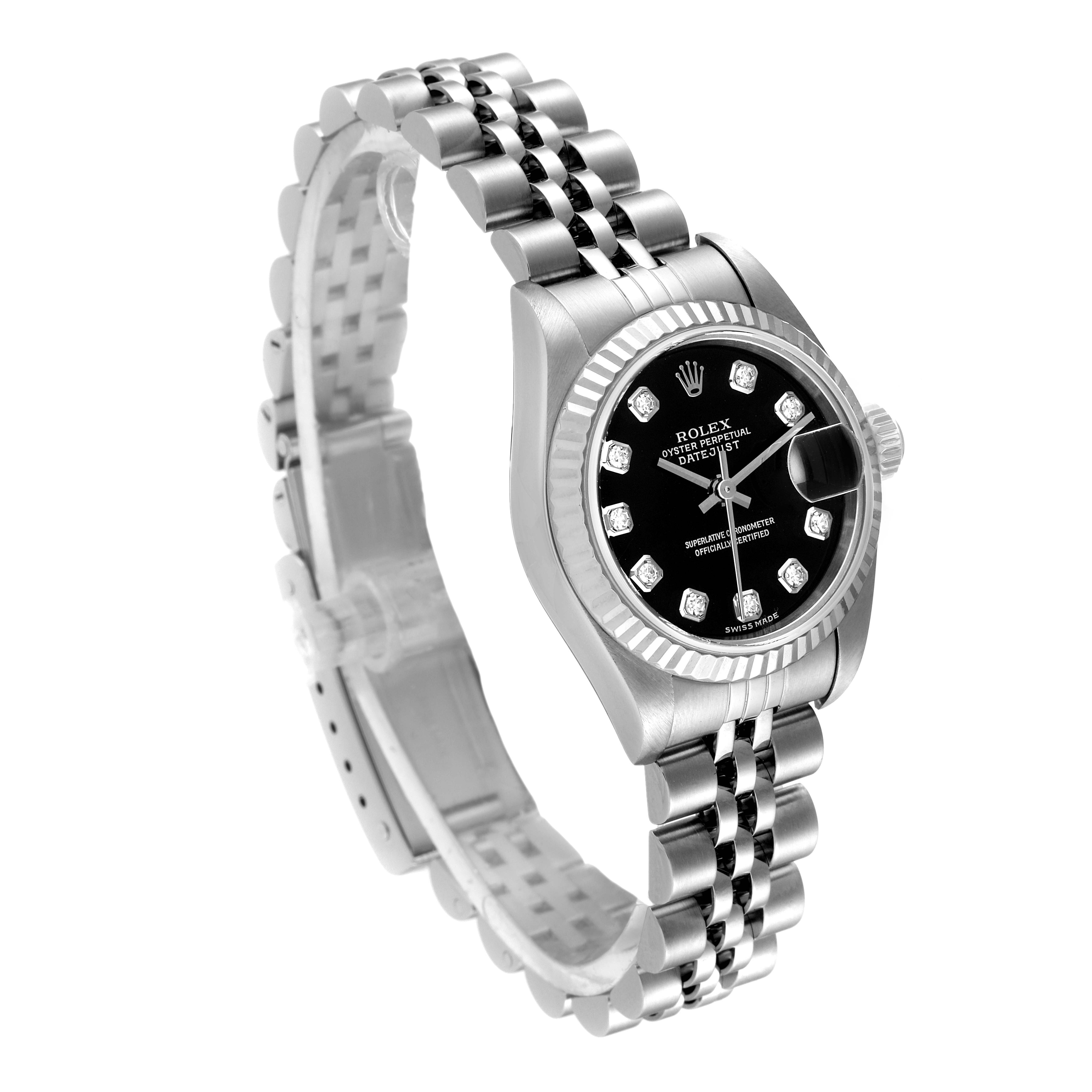 The image shows a Rolex Datejust 79174 Women's Stainless Steel Black Dial 79174 Women's Stainless Steel Black Dial watch at a front angle, highlighting its black dial, fluted bezel, and Jubilee bracelet.