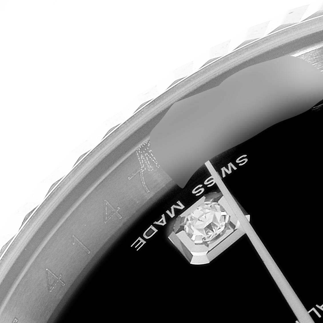 This image shows a close-up of the dial, bezel, and an hour marker of a Rolex Datejust 116234 Men
s Stainless Steel Black Dial 116234 Men
s Stainless Steel Black Dial watch.
