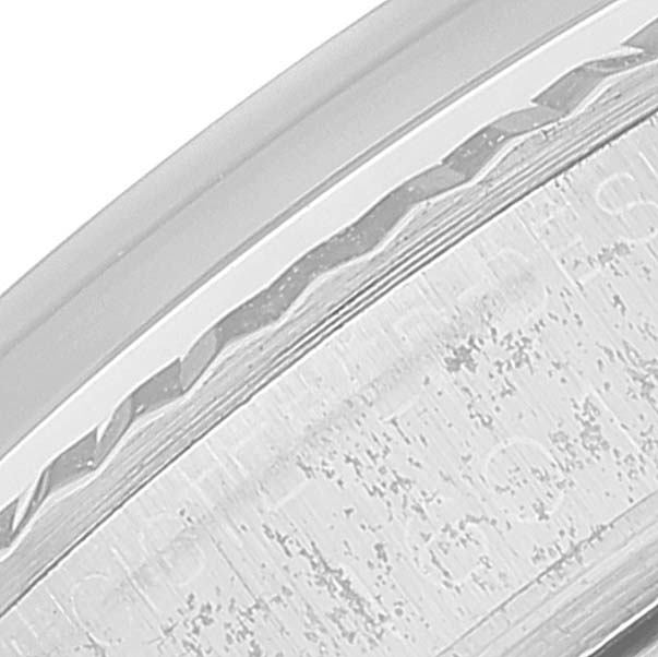 This close-up image showcases the textured edge of the bezel on the Rolex Vintage Collection 1601 Men
s Stainless Steel Silver Dial 1601 Men
s Stainless Steel Silver Dial watch.