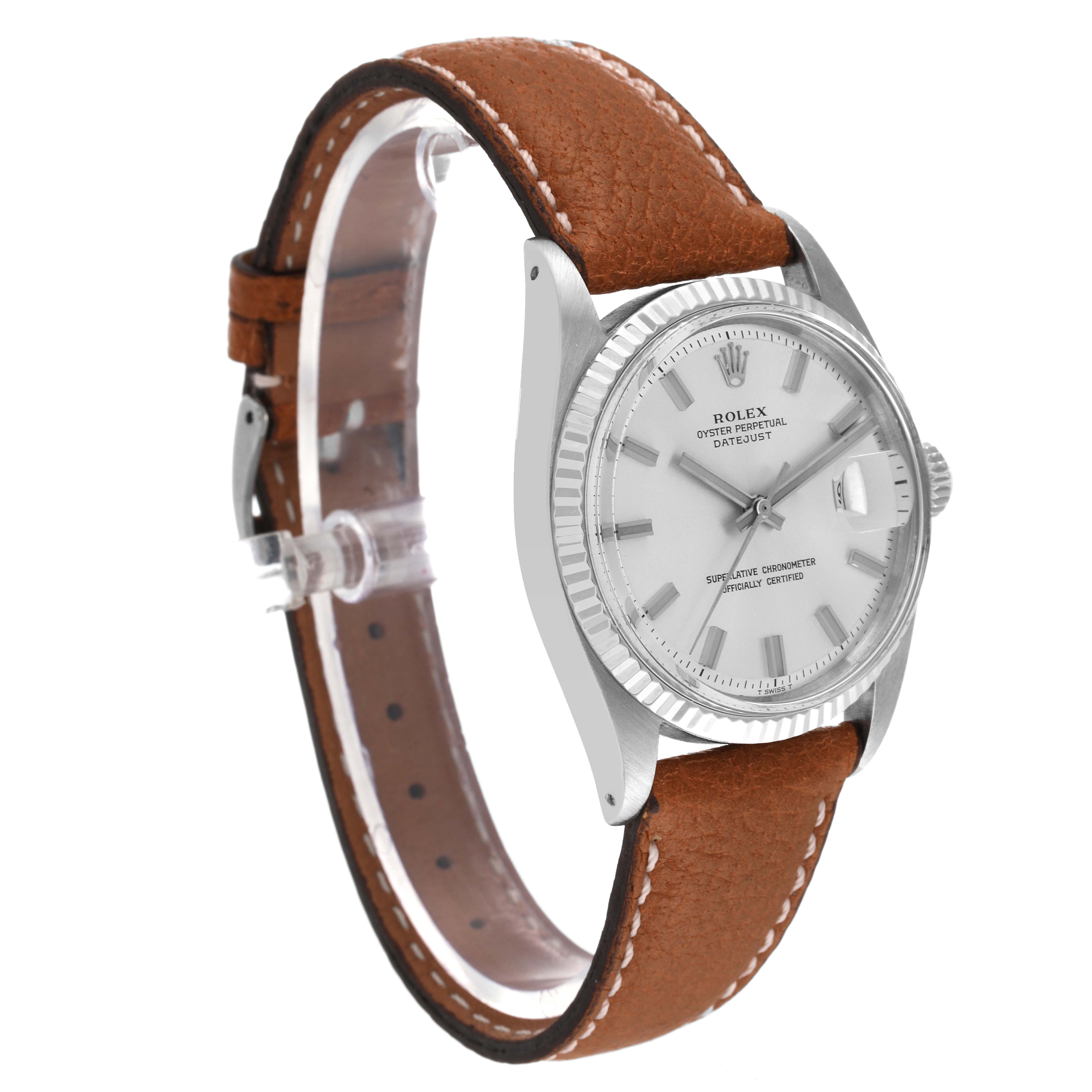 The image shows a side view of a Rolex Vintage Collection 1601 Men
s Stainless Steel Silver Dial 1601 Men
s Stainless Steel Silver Dial watch, featuring the dial, bezel, and leather strap.