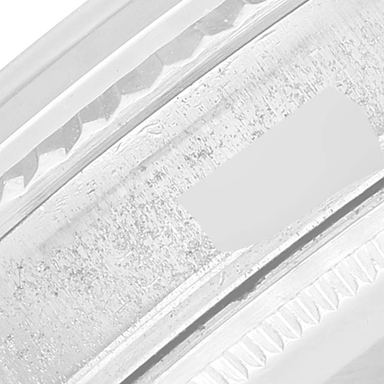 The image shows a close-up of the bezel of a Vintage Collection Rolex watch.