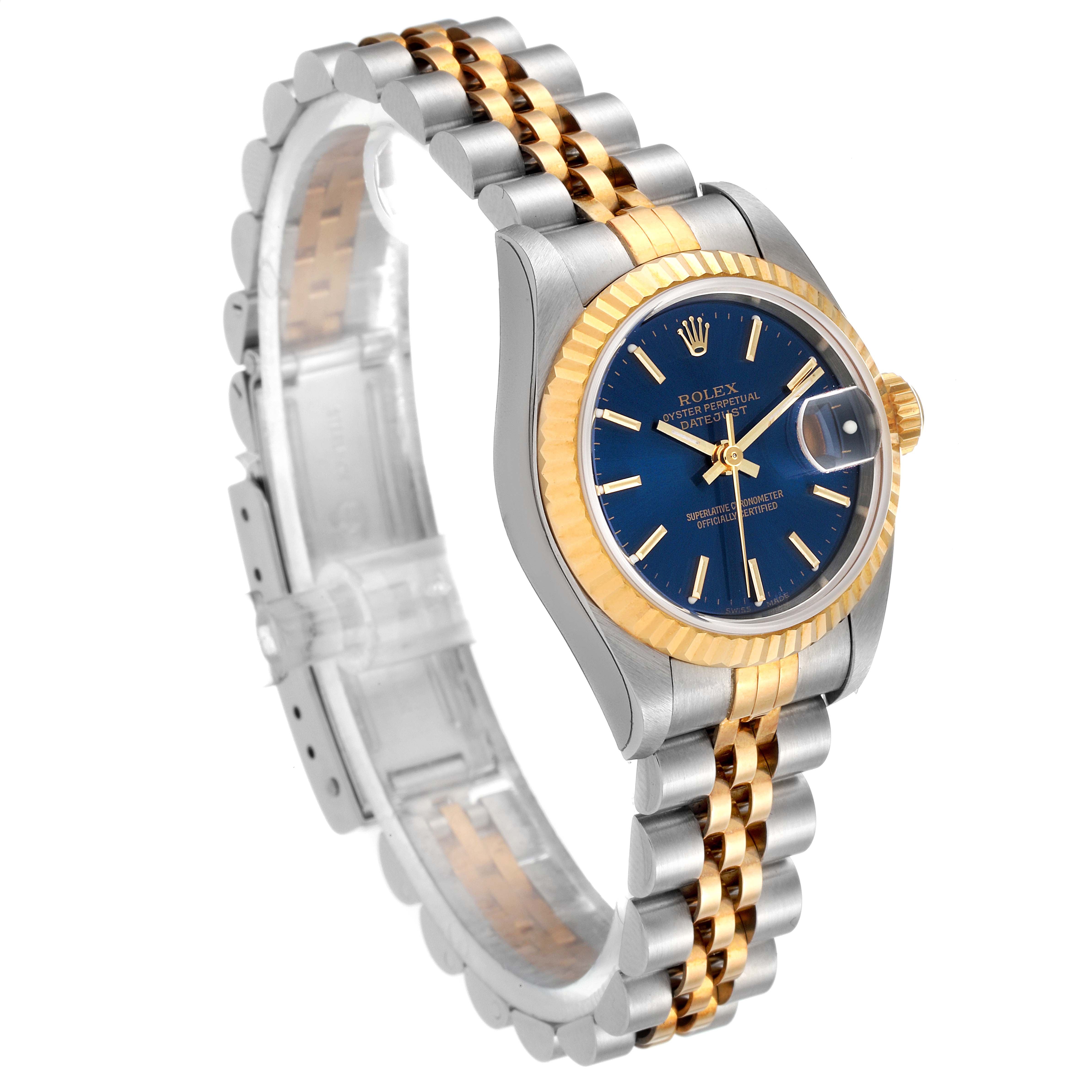 The image shows a side angle of a Rolex Datejust 79173 Women's Steel and Gold (two tone) Blue Dial 79173 Women's Steel and Gold (two tone) Blue Dial model, highlighting its blue dial, fluted bezel, and stainless steel and gold jubilee bracelet.