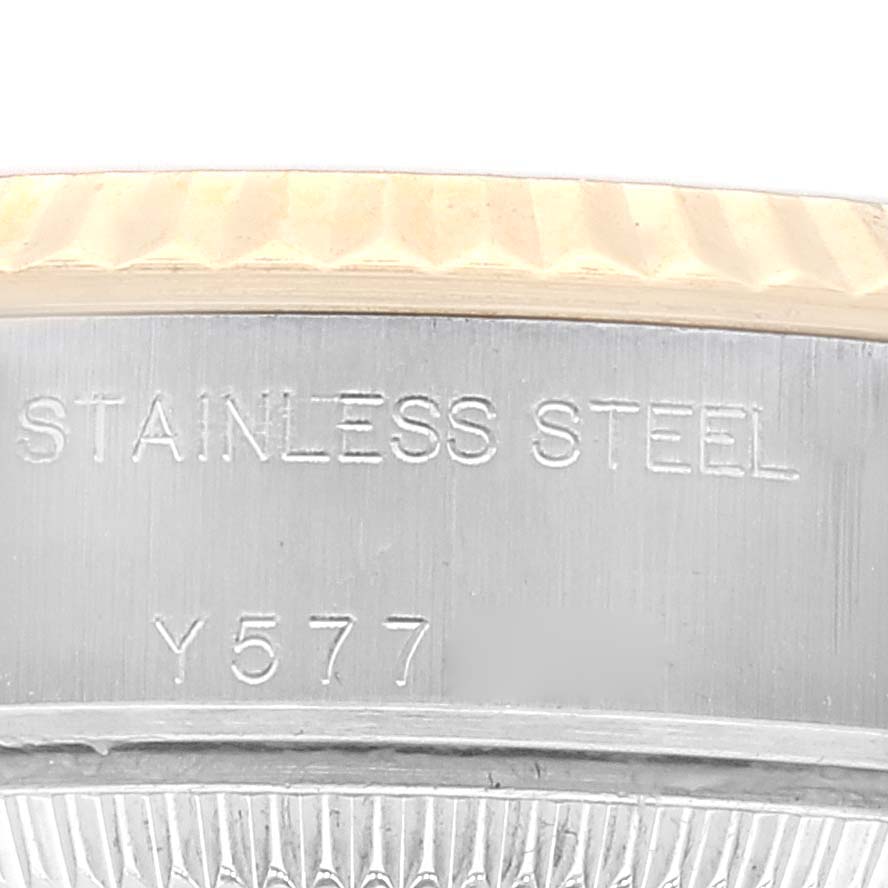 This image shows a close-up angle of the case side of a Rolex Datejust 79173 Women's Steel and Gold (two tone) Champagne Dial 79173 Women's Steel and Gold (two tone) Champagne Dial watch, highlighting its stainless steel composition and the reference number Y577.