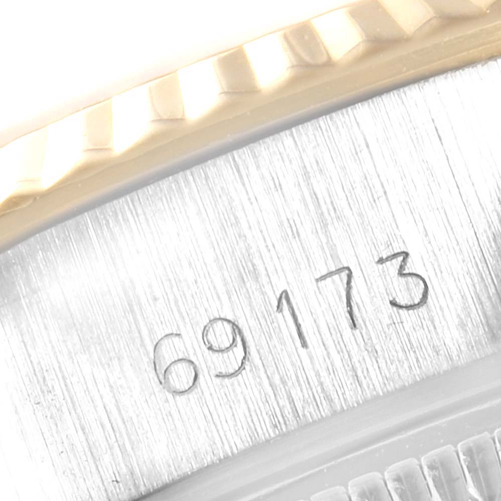 Close-up of the model number "69173" on the case of a Rolex Datejust 69173 Women's Stainless Steel Champagne Dial 69173 Women's Stainless Steel Champagne Dial watch, showing part of the bezel and caseback.