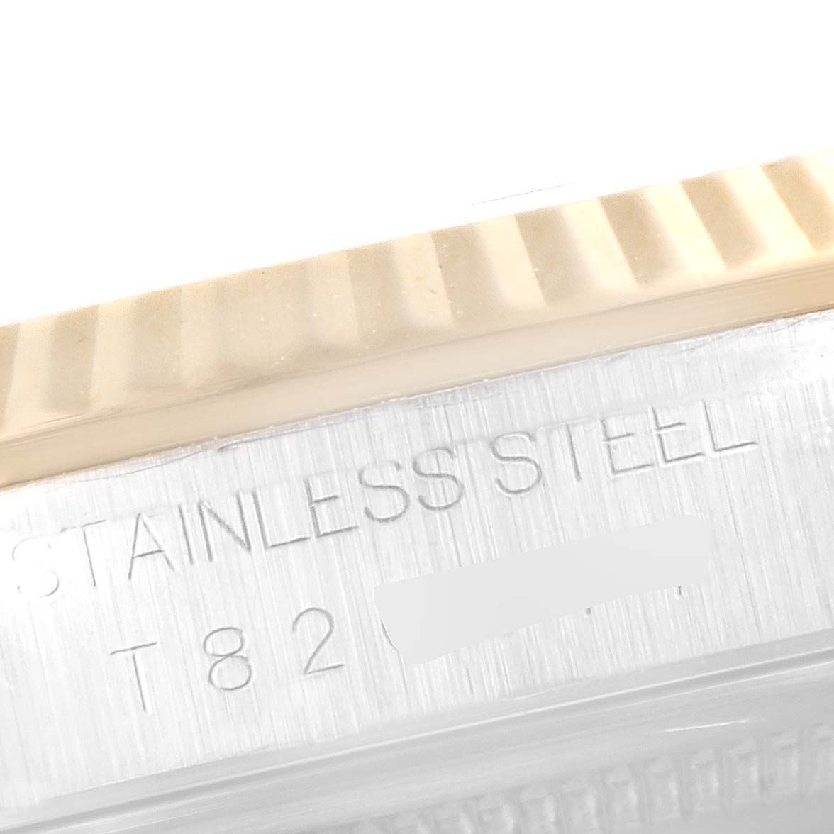 This close-up image shows part of the bezel and the case inscriptions of a Rolex Datejust 16233 Men's Steel and Gold (two tone) Grey Dial 16233 Men's Steel and Gold (two tone) Grey Dial watch.