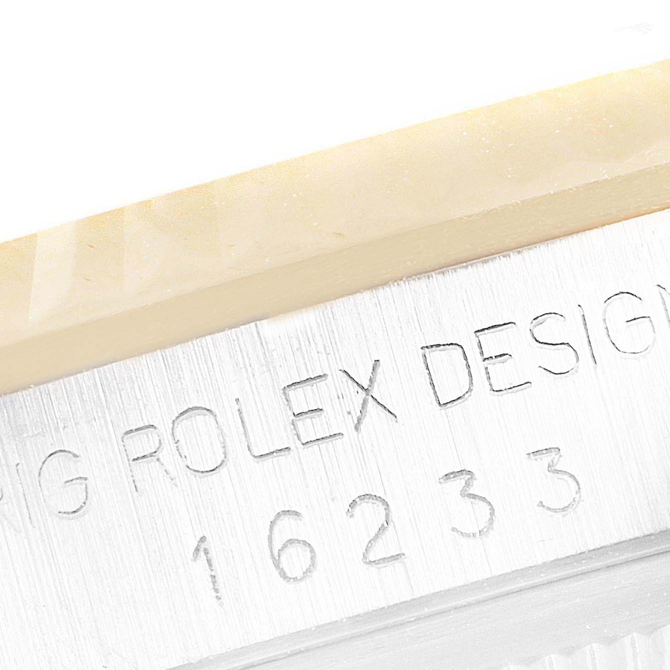 This image shows a close-up of the model number and inscription on the case side of a Rolex Datejust 16233 Men's Steel and Gold (two tone) Grey Dial 16233 Men's Steel and Gold (two tone) Grey Dial watch.