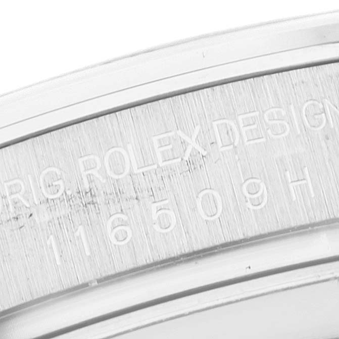 This image shows a close-up of the engraved serial number on the side of the bezel of a Rolex Daytona 116509 Men's White Gold Blue Dial 116509 Men's White Gold Blue Dial watch.