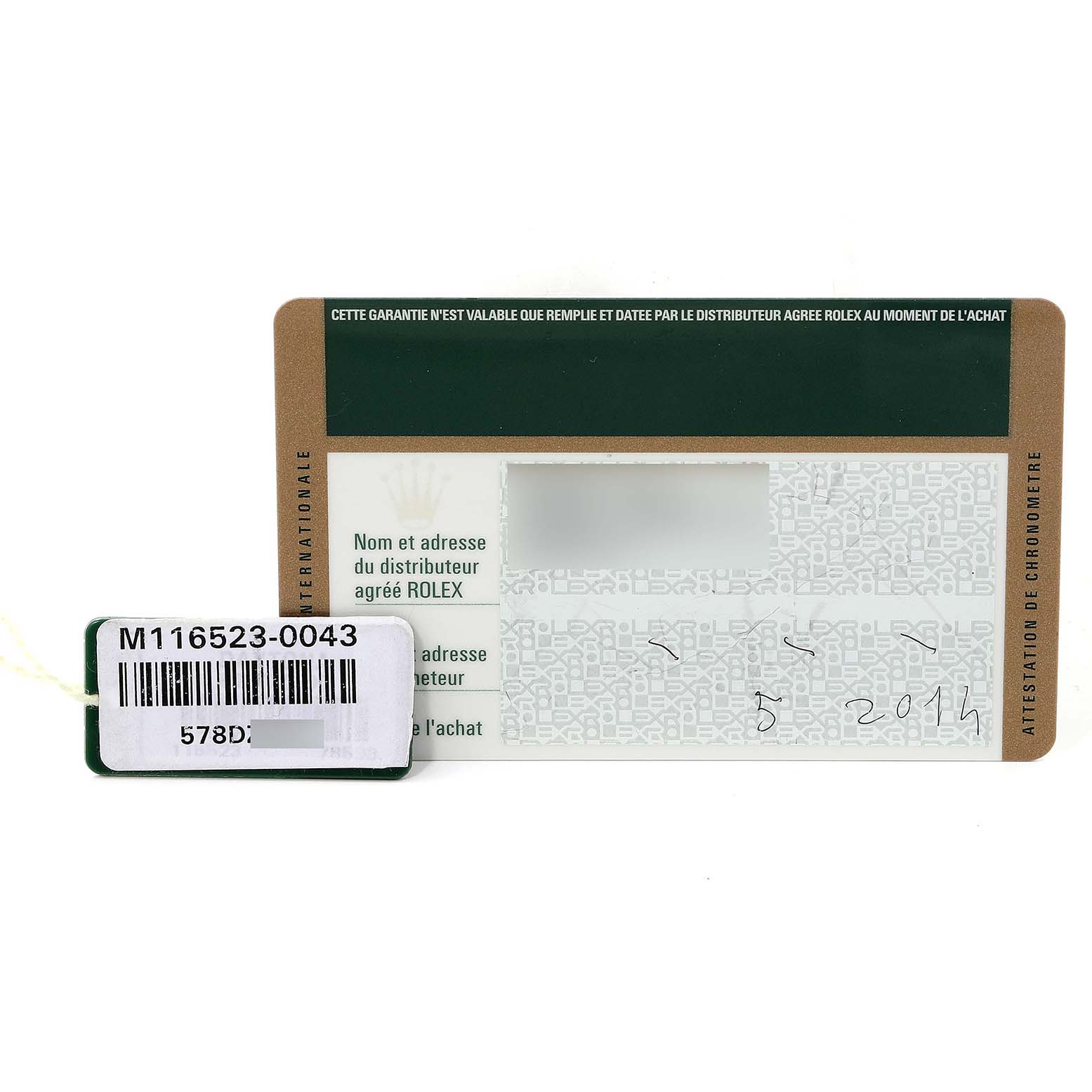 The image shows the warranty card and tag of a Rolex Daytona 116523 Men
s Steel and Gold (two tone) Black Dial 116523 Men
s Steel and Gold (two tone) Black Dial model.