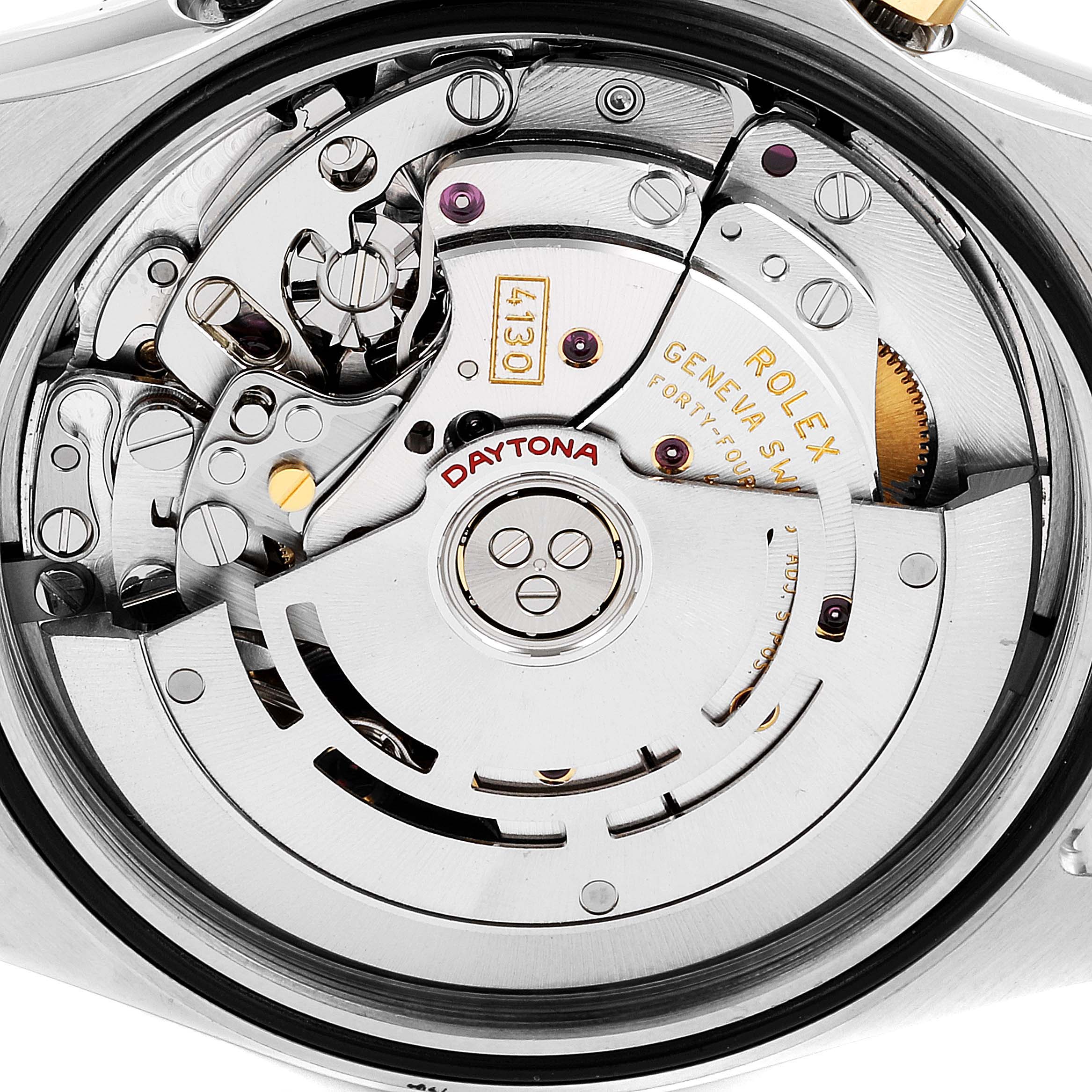 This image shows the intricate mechanical movement of a Rolex Daytona 116523 Men
s Steel and Gold (two tone) Black Dial 116523 Men
s Steel and Gold (two tone) Black Dial watch viewed from the back.