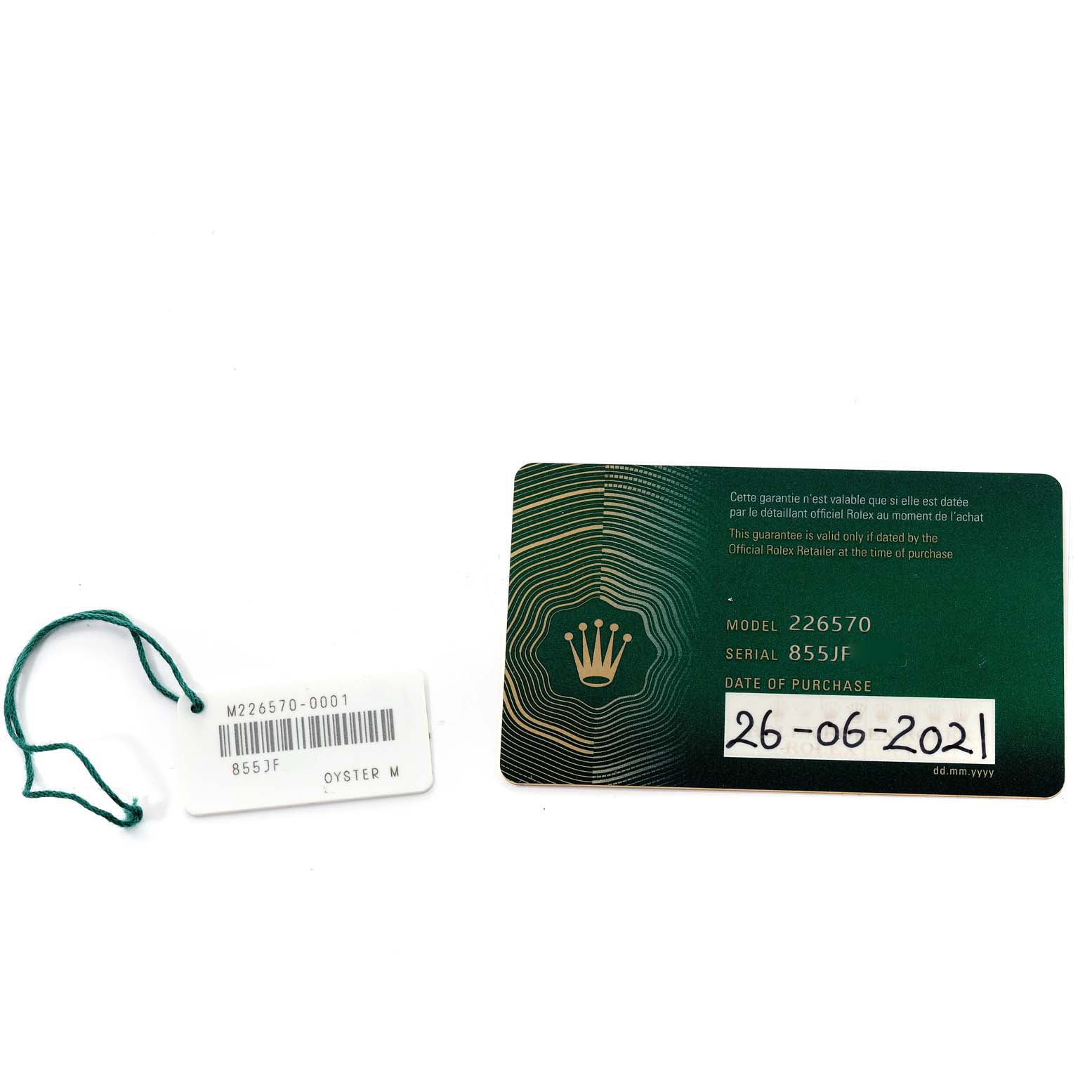 The image shows the warranty card and hang tag for a Rolex Explorer 226570 Men
s Stainless Steel White Dial 226570 Men
s Stainless Steel White Dial model watch.