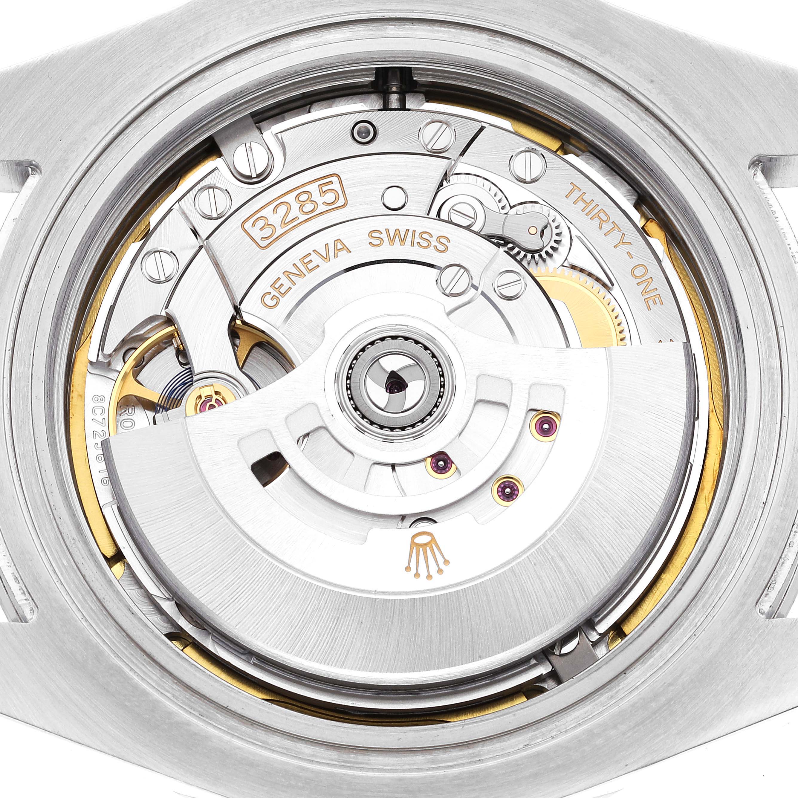 The image shows a close-up of the movement and inner mechanics of a Rolex Explorer 226570 Men
s Stainless Steel White Dial 226570 Men
s Stainless Steel White Dial watch.